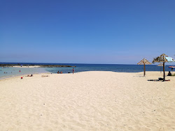 Foto von Punta Buren beach und die siedlung