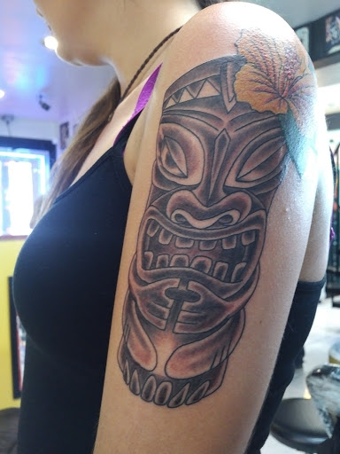 Explore red hand tattoo ideas, creative tattoo ideas in Honolulu, available at Sacred Art Tattoo Waikiki