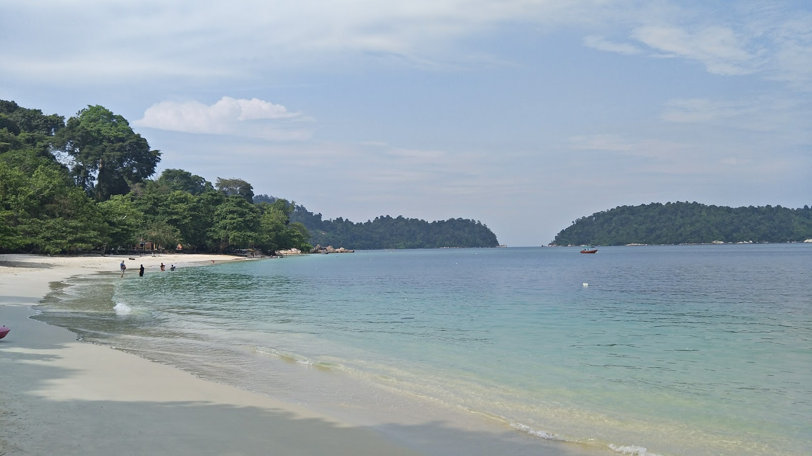 Photo of Teluk Nipah Coral Beach backed by cliffs