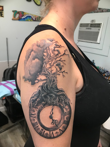 Explore spine tattoo cover up ideas, creative tattoo ideas in Ocala, available at The Tattoo Gallery of Ocala LLC