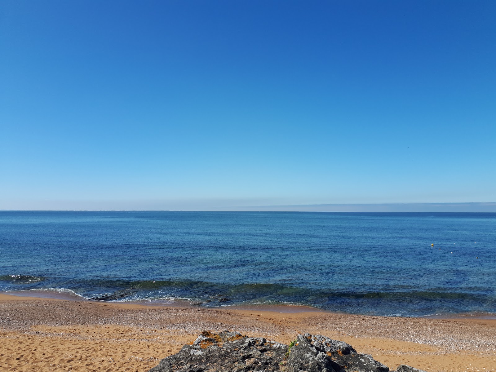 Portmain beach'in fotoğrafı - rahatlamayı sevenler arasında popüler bir yer