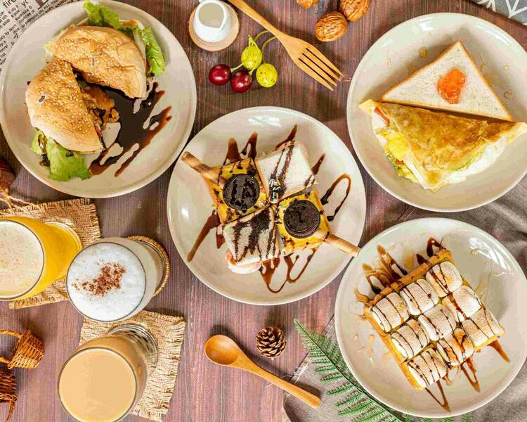 黑貓妞妞插畫創作複合茶飲 的照片