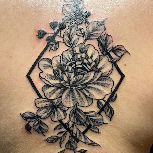 Explore black rose tattoo cover up ideas, creative tattoo ideas in Ozark, available at ChrisPeckTattoos