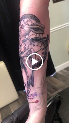 Explore breast cancer ribbon tattoo ideas, creative tattoo ideas in Englewood, available at Point of Entry Tattoo