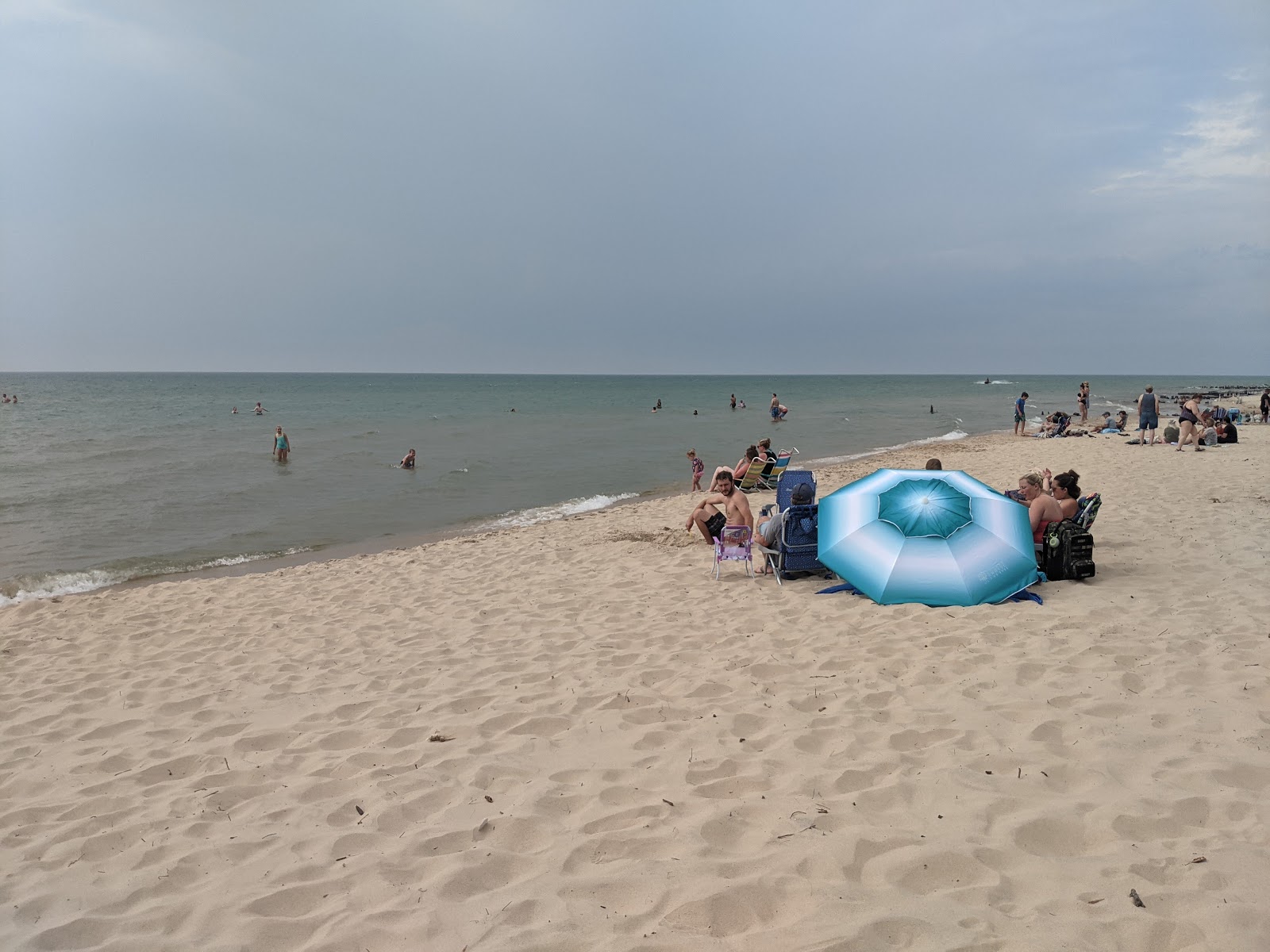 Photo of Golden Township Beach with turquoise pure water surface