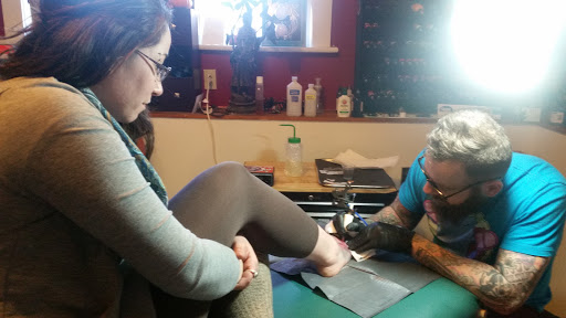 Explore wisdom tattoo ideas, creative tattoo ideas in Milford, available at Golden Hammer Tattoo Studios