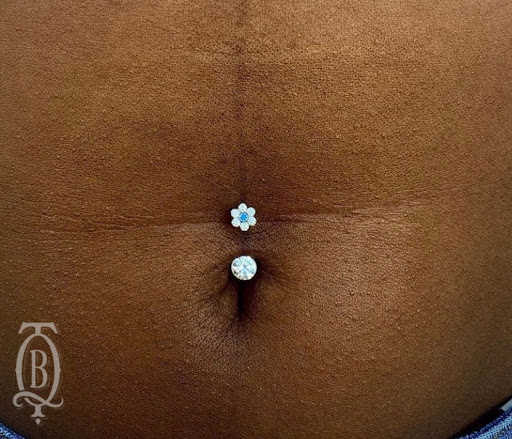 Explore side of finger tattoo ideas, creative tattoo ideas in Marietta, available at The Queen Bee Tattoo and Piercing Parlour