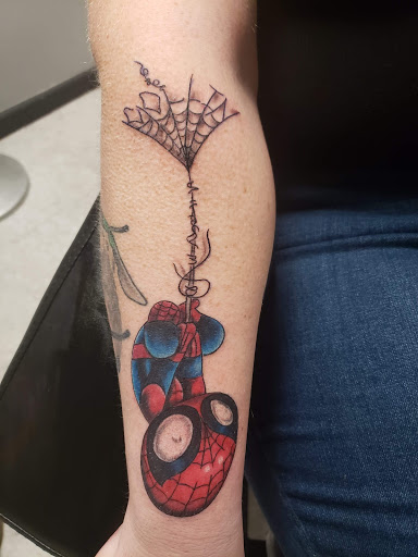 Explore spina bifida tattoo ideas, creative tattoo ideas in Hudson Falls, available at ALTERED ADDICTION TATTOOS