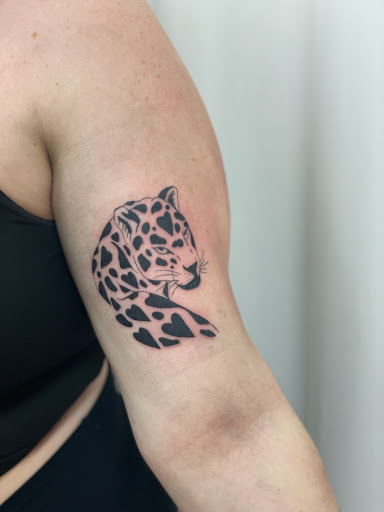 Explore checkered flag tattoo ideas, creative tattoo ideas in Sarasota, available at Diamond Reigns Tattoos