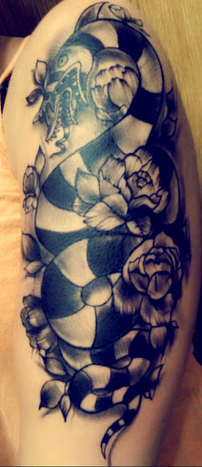 Explore western cowgirl tattoo ideas, creative tattoo ideas in South Boston, available at Eternal Rites Tattoo