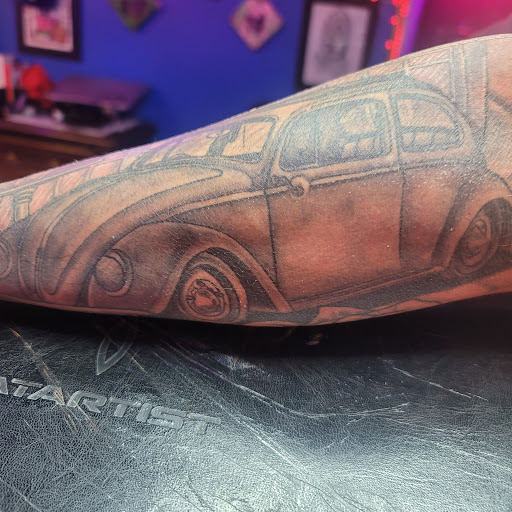 Explore tattoo ideas for dark skin guys, creative tattoo ideas in Chattanooga, available at The Sailors Den Tattoos and Piercing & The Scurvy Pearl Music Venue