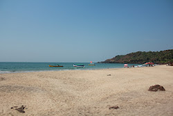 Foto di Canaguinim Beach sorretto da scogliere