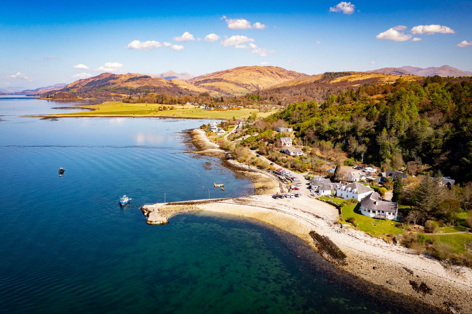 Photo of Port Appin Beach backed by cliffs