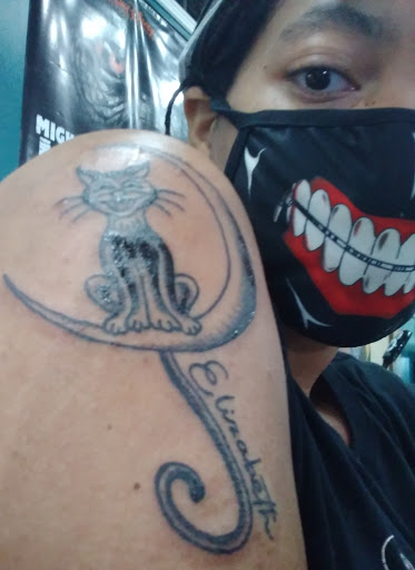 Explore purple flower tattoo ideas, creative tattoo ideas in Detroit, available at Grand Blvd Tattoo Co