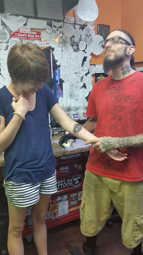 Find family symbol tattoo ideas for your next unique tattoo in Wilmington at The Gay Penguin Piercing and Tattoo in Wilmington Nc