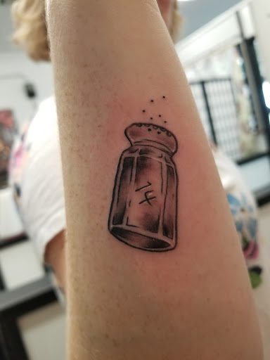 Explore street signs tattoo ideas, creative tattoo ideas in Rogers, available at Saved by Grace Tattoo Studio