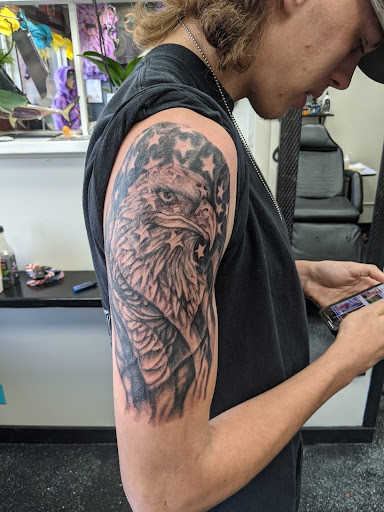 Explore cool shoulder tattoo ideas, creative tattoo ideas in Slippery Rock, available at Dinky Dachshund Tattoo Parlor