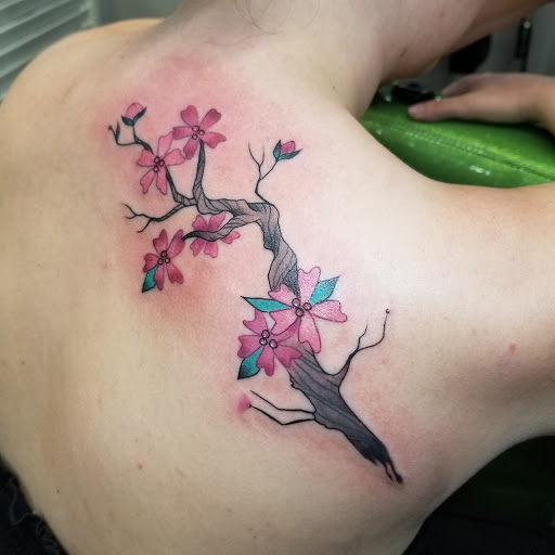 Explore flower back tattoo ideas, creative tattoo ideas in Three Rivers, available at Portfolio Ink, LLC