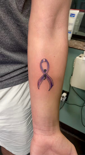 Explore guitarist tattoo ideas, creative tattoo ideas in Meridian, available at Creative Pain Tattoo Studio