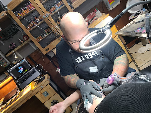 Explore matching tattoo ideas for father and son, creative tattoo ideas in Toledo, available at Infinite Art Tattoo Studio