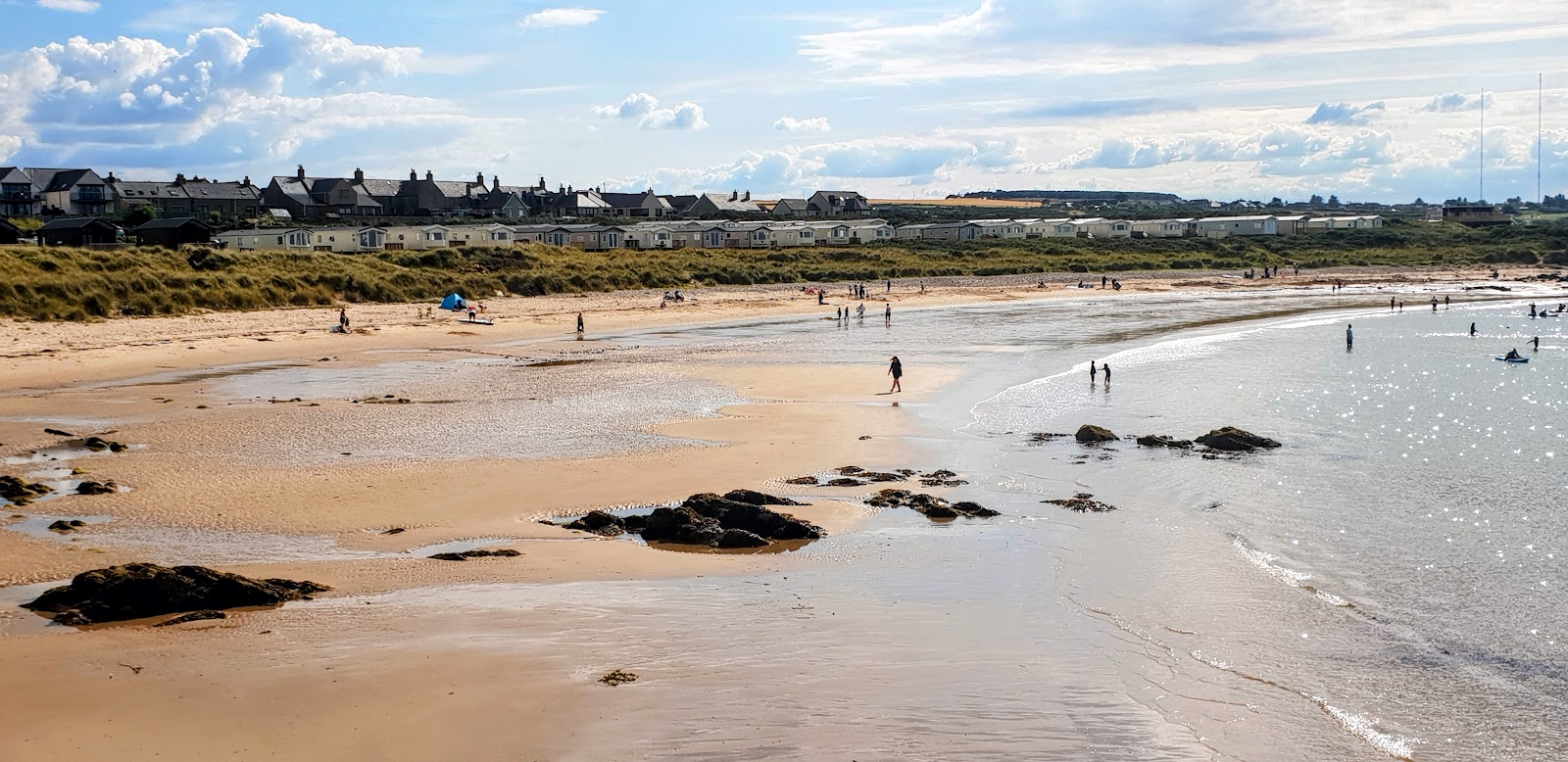 Photo of Hopeman East Beach with turquoise pure water surface