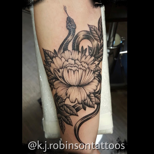 Explore swimming tattoo ideas, creative tattoo ideas in Lawrenceville, available at Magick Dragon Tattoo