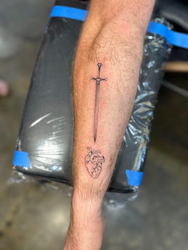 Explore gun tattoo ideas, creative tattoo ideas in Bloomington, available at Crimson Breed Tattoo Studio