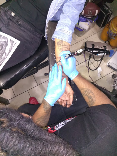 Explore marriage ring tattoo ideas, creative tattoo ideas in Atlanta, available at Iron Palm Tattoos & Body Piercing Atlanta