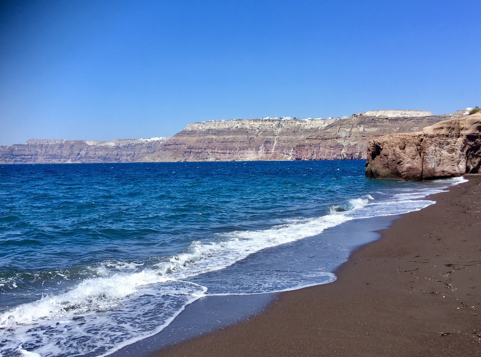 Foto van Caldera beach met turquoise puur water oppervlakte