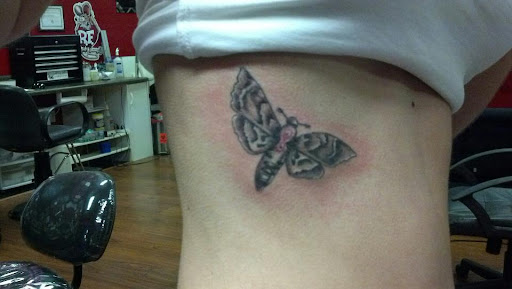 Explore cheek tattoo ideas, creative tattoo ideas in Largo, available at Alchemy Tattoos and Body Piercings
