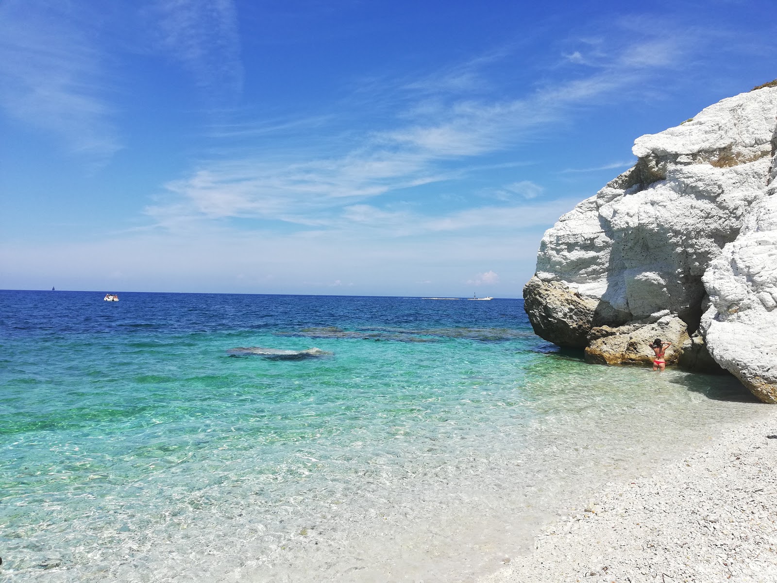 Foto van Strand van Capo Bianco en de nederzetting