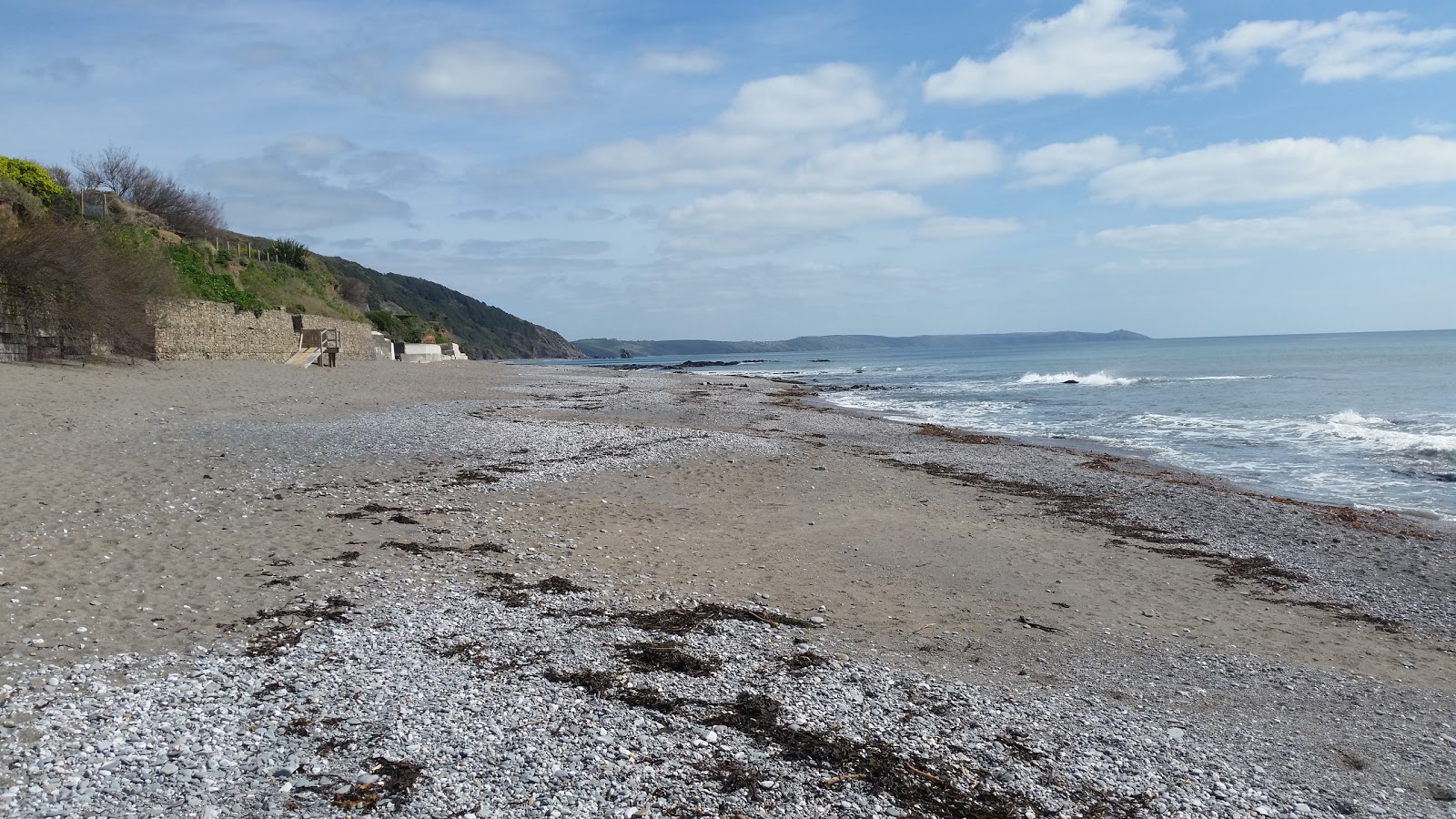 Photo of Downderry beach with turquoise water surface