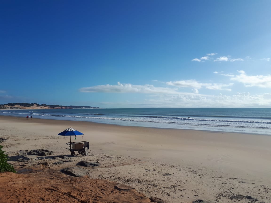 Foto von Cardeiro Strand mit feiner beiger sand Oberfläche
