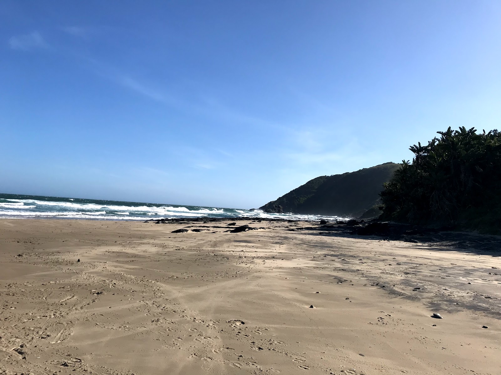 Umngazana beach III的照片 带有碧绿色纯水表面