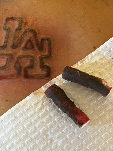 Explore rock and roll tattoo ideas, creative tattoo ideas in Victorville, available at Goawaytats tattoo removal