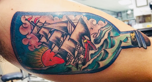 Explore colored tattoo sleeve ideas, creative tattoo ideas in Franklin, available at Hellcat Tattoo Franklin