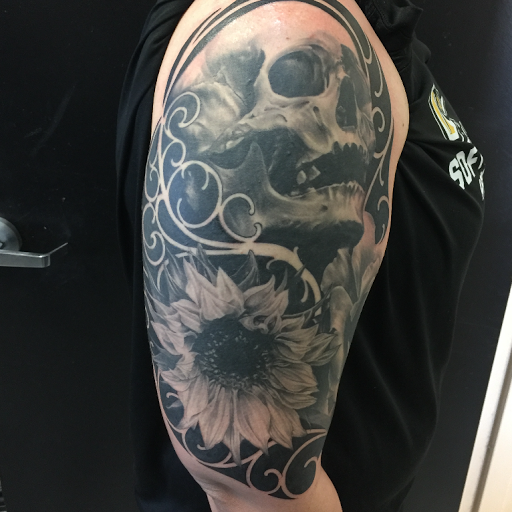 Explore hellscape battle sleeve tattoo ideas, creative tattoo ideas in Oklahoma City, available at Oklahoma Tattoo Collective
