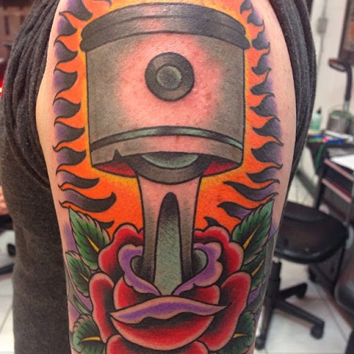 Explore parrot tattoo ideas, creative tattoo ideas in Honolulu, available at Sacred Art Tattoo Waikiki