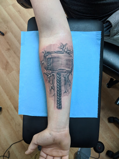 Explore flower spine tattoo ideas, creative tattoo ideas in Kenosha, available at Kenosha Tattoo Company