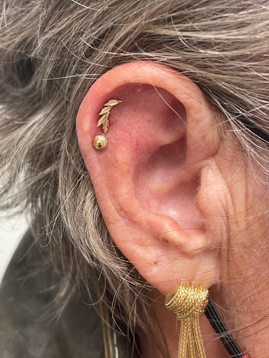 Explore sunflower and butterfly tattoo ideas, creative tattoo ideas in Louisville, available at Inksmith Tattoo and Piercing