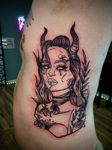 Explore 2 face tattoo ideas, creative tattoo ideas in North Tonawanda, available at Dark Side Ink Tattoo Studio