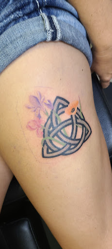 Explore dainty flower tattoo ideas, creative tattoo ideas in Nashville, available at RedBird Tattoo