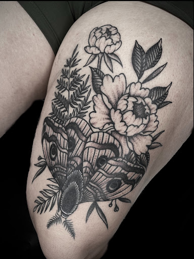 Explore unique side thigh tattoo ideas, creative tattoo ideas in Johnson City, available at Gold Cross Tattoo Co.
