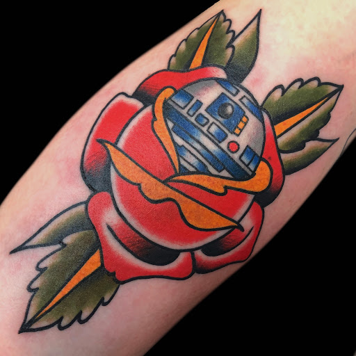 Explore flower spine tattoo ideas, creative tattoo ideas in Lakeland, available at Black Swan Tattoo