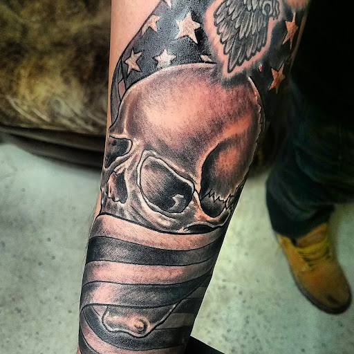 Explore lion forearm tattoo ideas, creative tattoo ideas in Plainfield, available at Tattoo Warehouse AND Body Piercings