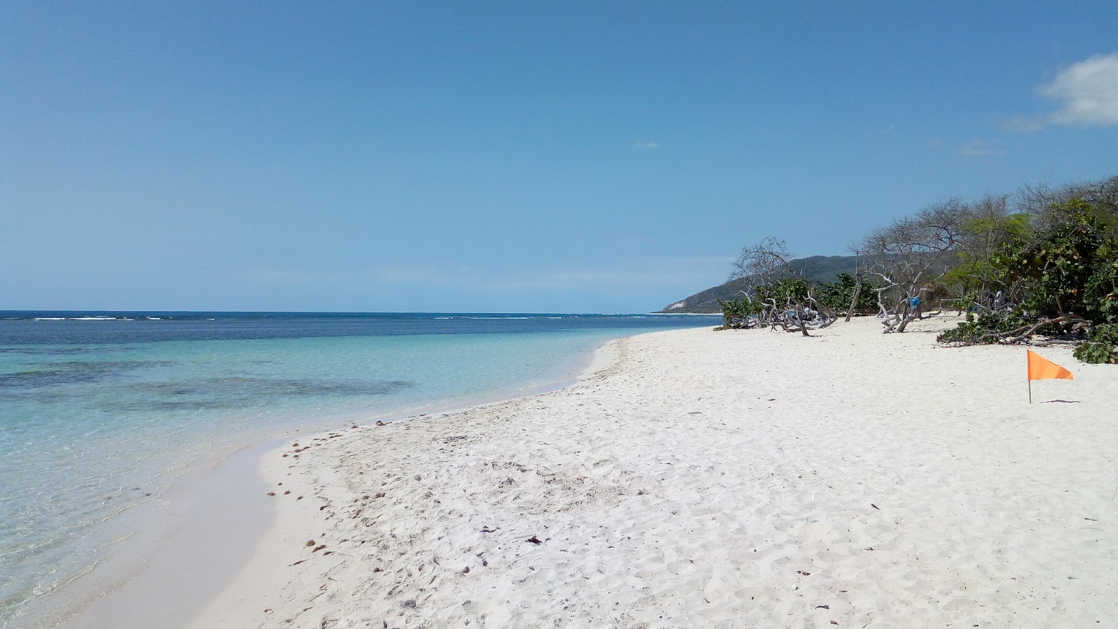 Foto van La Caobita beach met helder fijn zand oppervlakte