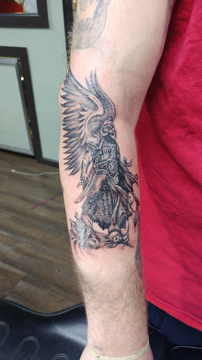 Explore lower sleeve tattoo ideas, creative tattoo ideas in East Northport, available at Tormented Souls