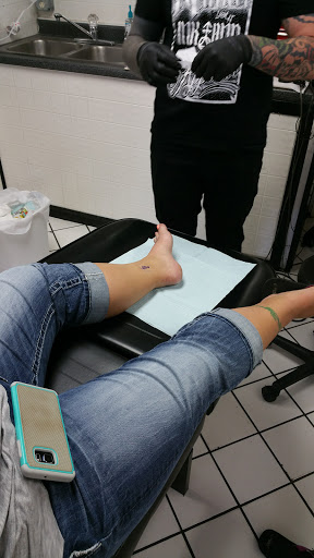 Explore dainty spine tattoo ideas, creative tattoo ideas in Panama City Beach, available at Oxygen Tattoo and Body Piercing Studio