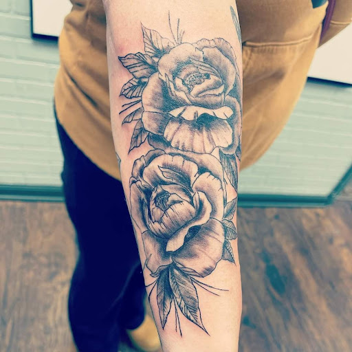 Explore sleeve tattoo ideas for women, creative tattoo ideas in Warren, available at Aces Tattoo & Body Piercing