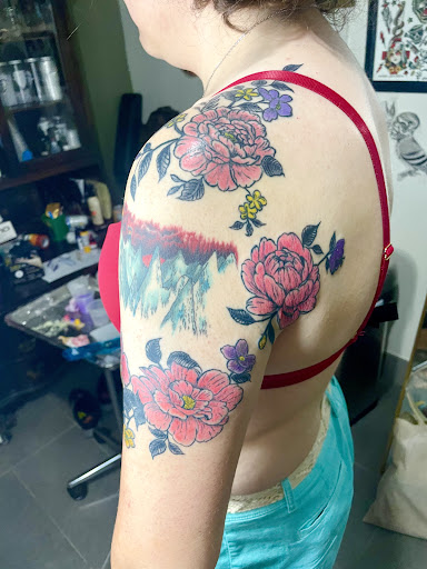 Find dino tattoo ideas for your next unique tattoo in Brooklyn at Queen of Crowns Tattoo